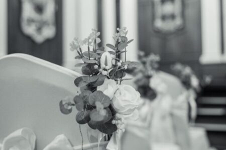 Floral display secured to a wedding chair