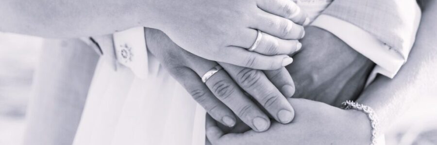 Couple Hugging Showing Hands with Rings